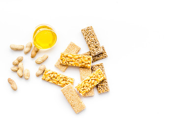 Energy protein snacks with peanuts on white background top view