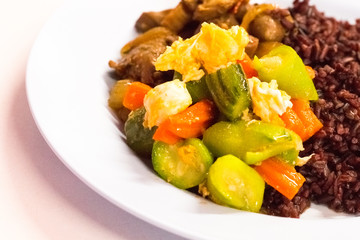 Cost-up Thai food menu is rice berry,Stir-fried Zucchini with Eggs,Shrimps and pork and and curry on white background. It copy space and selection focus.