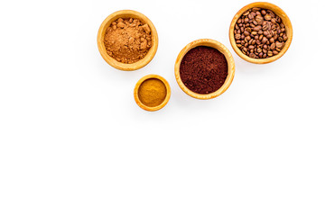 Ground seasoning for cooking desserts. Cinnamon, cocoa, coffee powder on white background top view copy space