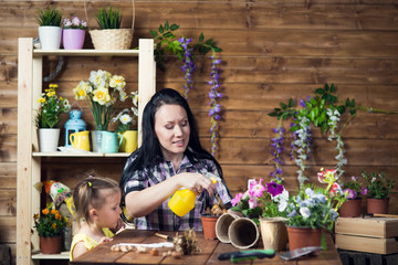 Mom and child are planting flowers