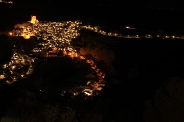 Views of the illuminated village of Alcala del Jucar at night from the viewpoint