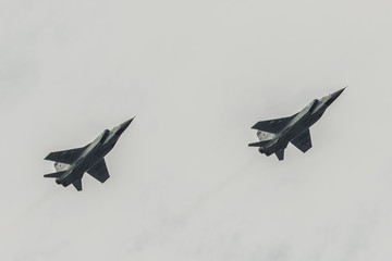 two airplanes mig 31 flying against the sky - obrazy, fototapety, plakaty
