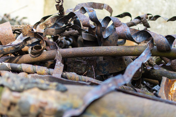 Rusty metal waste lying unsorted in a heap