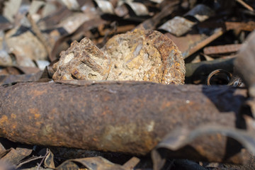 Rusty metal waste lying unsorted in a heap