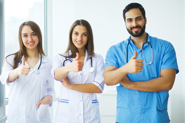 Happy Successful Medical Team work together in hospital