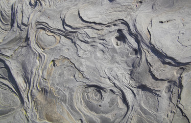 Close up of intricate texture of rock formation as background.