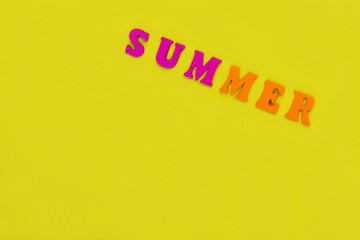 word summer of multicolored letters on bright yellow background