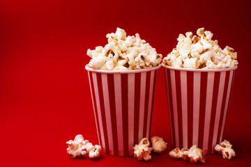 popcorn in two hollow boxes on a red background