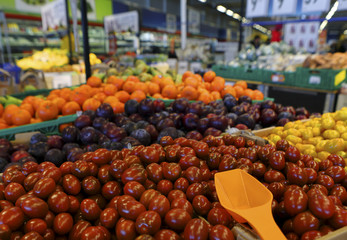 Various vegetables and fruit on a counter in supermarket, DOF.