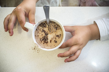 cup of chocolate powder with milk