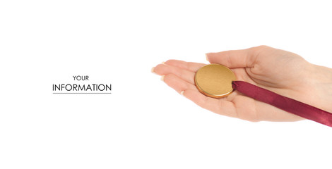 A gold medal in hand pattern