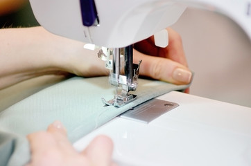 Sewing machine. Garment factory. The work of the weavers. Weaving.