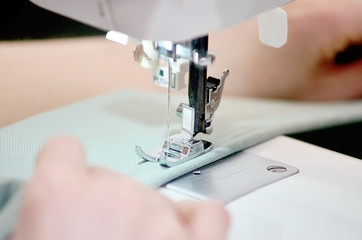 Sewing machine. Garment factory. The work of the weavers. Weaving.