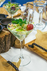 Beautiful catering banquet table with different food snacks and appetizers decorated for celebration party, closeup.