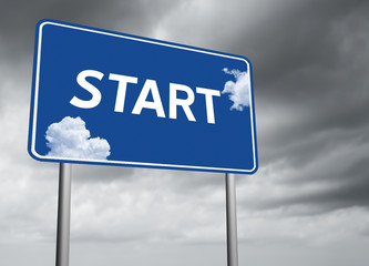 Obraz premium Motivational Start highway sign with blue sky after the storm