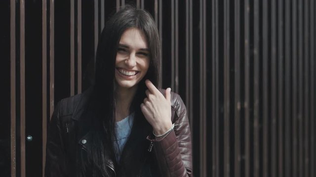 portrait of a young woman genuinely laughing and rejoicing outdoor
