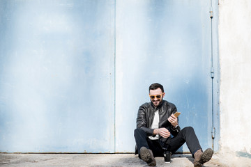 Man portrait on the blue wall background