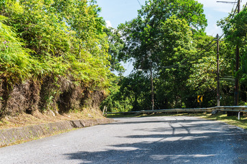 Mountain roads and through jungle in sunny day on tropical island, Malaysia.The route is beautiful.