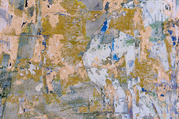 Grunge wall with old paint and paper