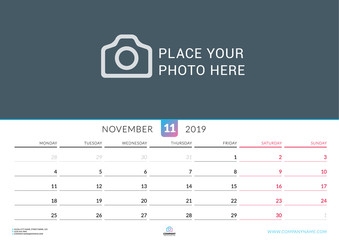 Wall calendar for November 2019. Vector design print template with place for photo. Week starts on Monday. Landscape orientation