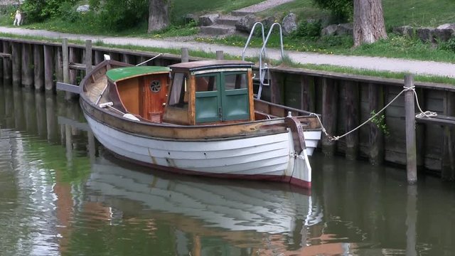 Boat in canal in Trosa, Sweden.