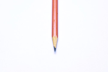 Close-up on colorful multicolored sharp pencils. Isolated over white background. Top view