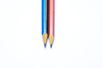 Close-up on colorful multicolored sharp pencils. Isolated over white background. Top view