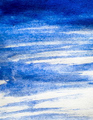 Obraz premium Texture of blue watercolour paint on white paper. Vertical background with stains of watercolor brush strokes.