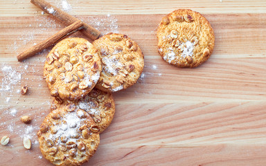 Cookies with peanuts on the wooden table. Copy space.