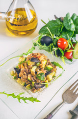 Turkish traditional Lentil salad and a slice of cucumber and green ezogelin, tarhuna.