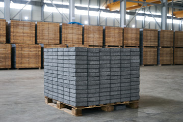 Close-up of a Concrete road curbs at the factory for the production of cement products, paving slabs. Industry manufacturing concept