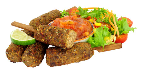 Lamb koftas with tomato salsa and fresh salad isolated on a white background