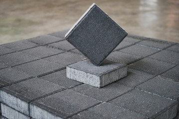 Gray Concrete road curbs at the factory warehouse for the production of cement products, paving...