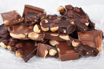 pieces of chocolate with nuts, close-up delicacy