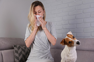 Man having pet allergy symptoms : runny nose, asthma - obrazy, fototapety, plakaty