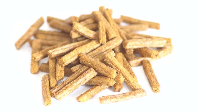 Portion of rotating Bread Chips as seamless loopable 4K UHD footage