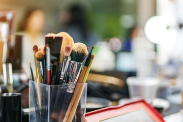 Closeup photo of makeup brushes in the beauty salon