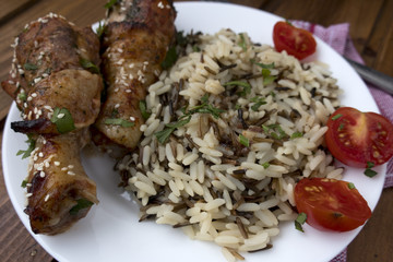 cooked rice with fried chicken legs