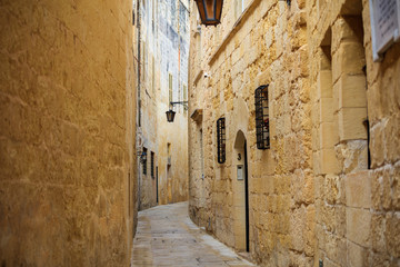Fototapeta na wymiar Malta, Mdina. Old medieval city narrow streets, houses sandstone facades