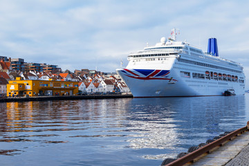 Norway cruise ship and small boat at the port ready to sail