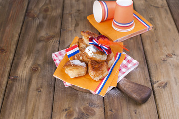 Traditional Dutch sweet pastries. Feast day of the King. Decor. Orange things for the holiday. Flag of the Netherlands