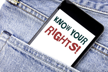 Handwriting Announcement text showing Know Your Rights. Business concept for Justice Education Written phone mobile phone, cellphone placed in the man front jeans pocket.