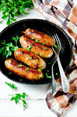 Homemade sausages from turkey (chicken) fried in a frying pan