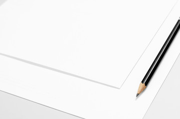 Blank stationery: sheets of paper and pencil 