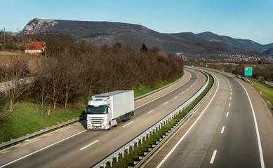 White truck in motion on the highway road