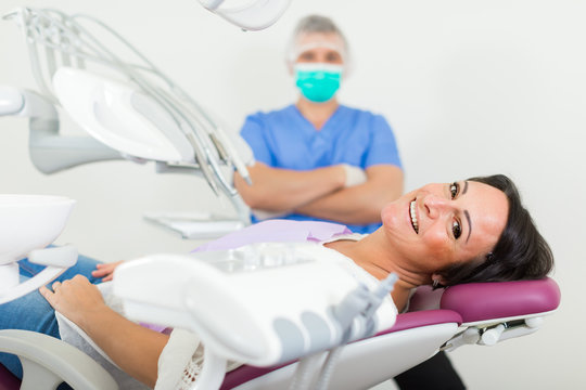 dentist  with positive visitor woman