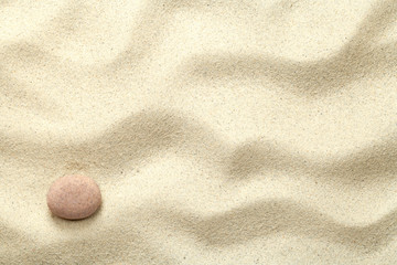 Fototapeta na wymiar Sand Background with Stone