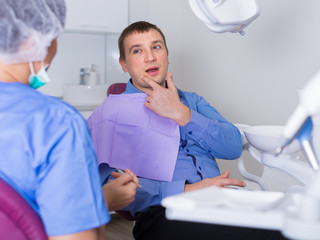 adult dentist woman with patient