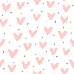 Cute seamless pattern with repeating hearts and round dots drawn by hand. Endless girlish print.
