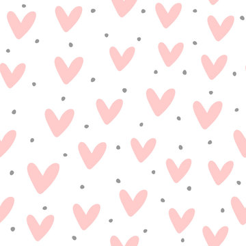 Cute seamless pattern with repeating hearts and round dots drawn by hand. Endless girlish print.